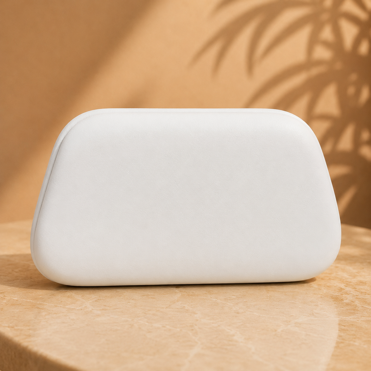 White clutch on a wooden surface with a warm background